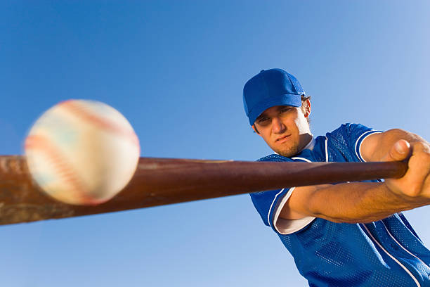 Batter Hitting Baseball Batter Hitting Baseball batting sports activity stock pictures, royalty-free photos & images