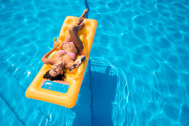 istock Laughing girl lying on air mattress 485524996