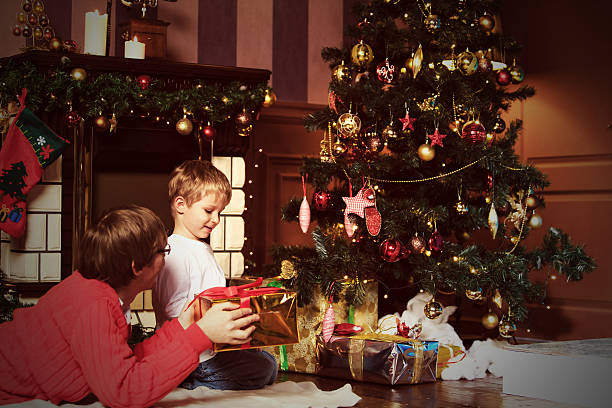 istock father and son giving presents on Christmas 485525466
