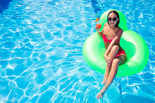 istock Woman resting on air mattress 485526398