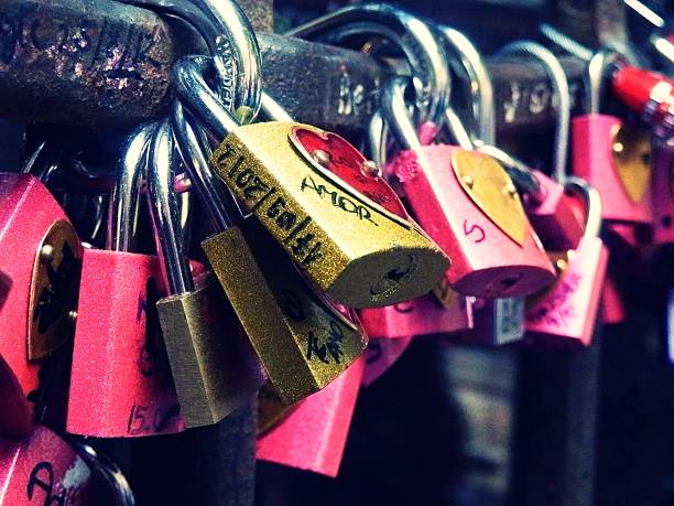 detail of locks of love with writings in Verona, Italy