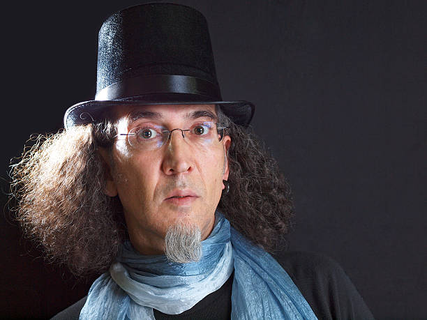 istock Man with long hair, goatee beard and top hat 485527261