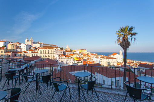 Open café tarrace with breathtaking view at Alfama - historical city-center of Lisbon, Portugal