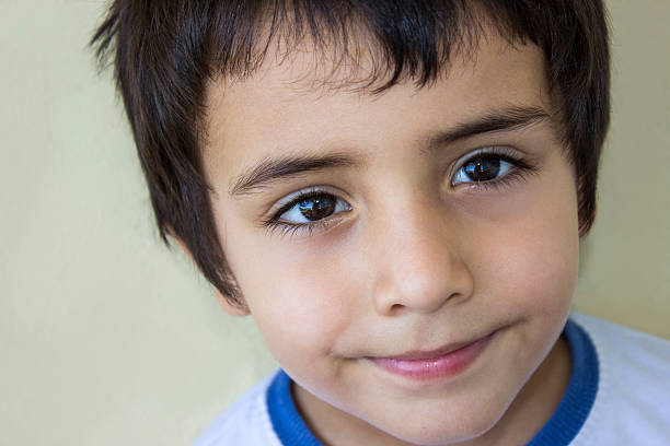 istock Portrait of a smiling child against colored background 485530970