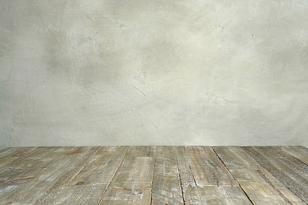 istock grungy concrete wall and wooden floor 485531908