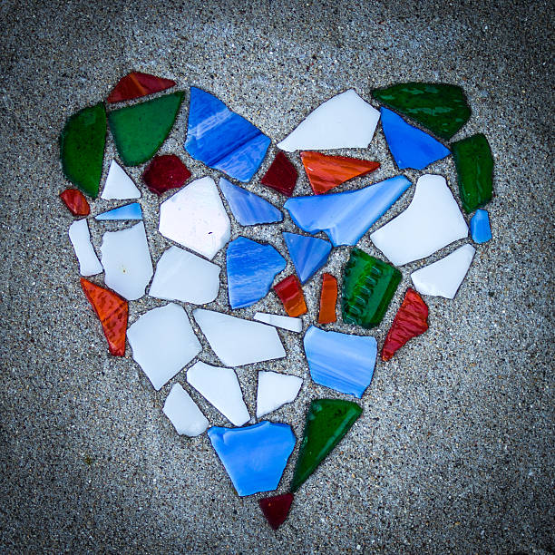 istock Heart mosaic in glass fragments on concrete base 485532370