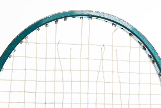 Tennis Racket Head with broken strings stock photo