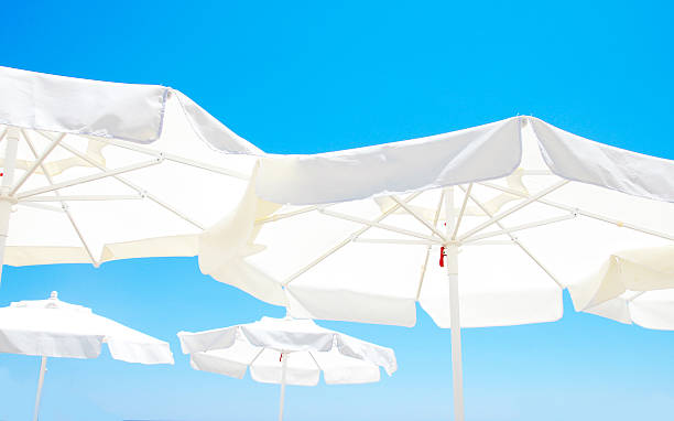 istock Beach umbrella against blue morning sky 485535476