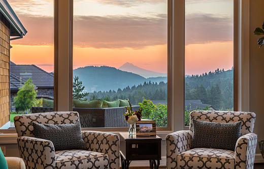 living room with beauitiful sunrise and mountain backdrop