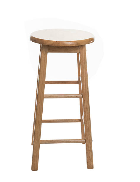 Wooden Bar Stool A tall wooden stool on a isolated white background shot in a studio bar stool photos stock pictures, royalty-free photos & images