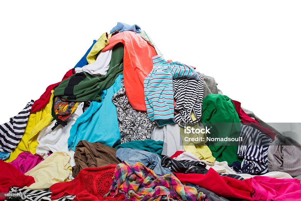 Big heap of colorful clothes Big heap of colorful clothes isolated on white Clothing Stock Photo