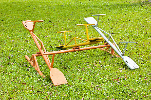 istock .Seesaw playing on the lawn 485539952