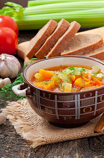 istock Vegetable soup on the old wooden background 485540193