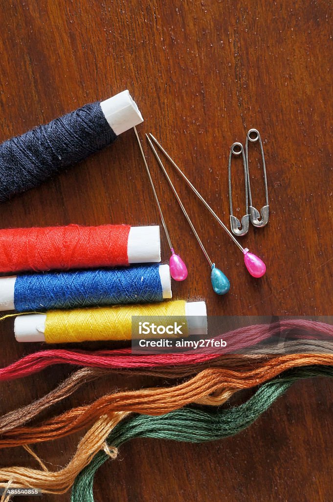 Sewing items with a vintage feel Sewing items with a vintage feel, thread, antique scissors, pins and buttons Art And Craft Stock Photo