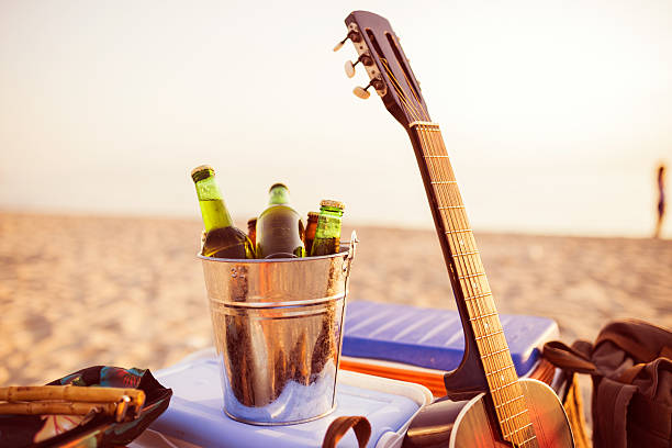 istock Beer in a bucket of ice on a beach. 485543990