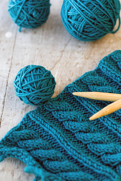 istock Knitting pattern and needles on a wooden background 485543996