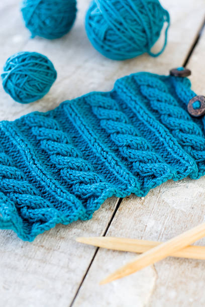 istock Knitting pattern and needles on a wooden background 485544002