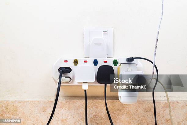 Multiple Electricity Plugs Attached To Multi Adapter Is Dangerou Stock Photo - Download Image Now