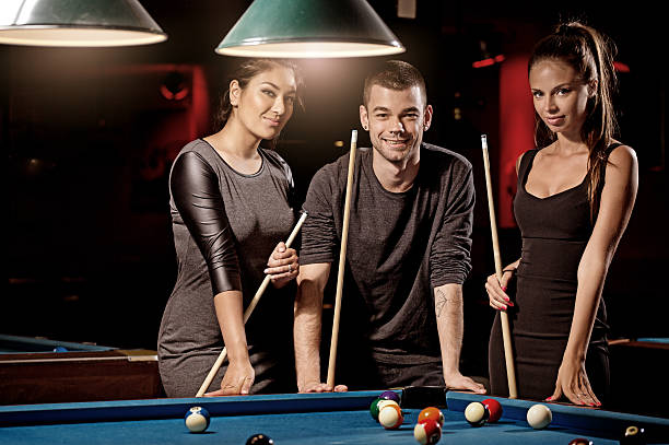 istock Group of friends in a local pool hall 485549156