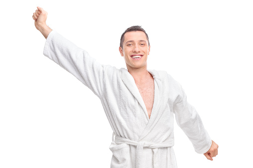 Mature man wearing a white bathrobe on white background  (this picture has been shot with a super high definition Hasselblad HD3 II 31 megapixels camera)