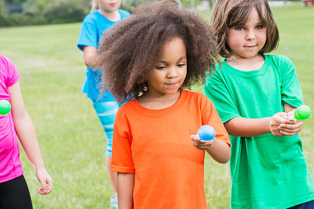 istock Group of children in egg spoon race 485555766