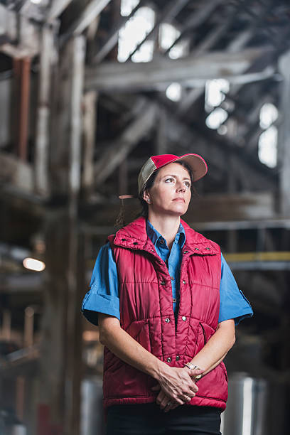 istock Female worker standing in industrial building 485555788