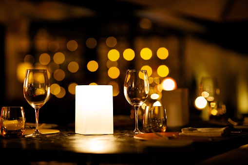 A shot of wine glasses on romantic dining table