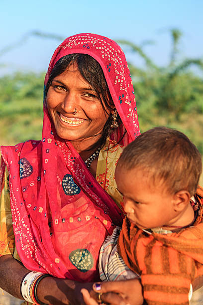 istock Young Indian woman holding her child 485556989