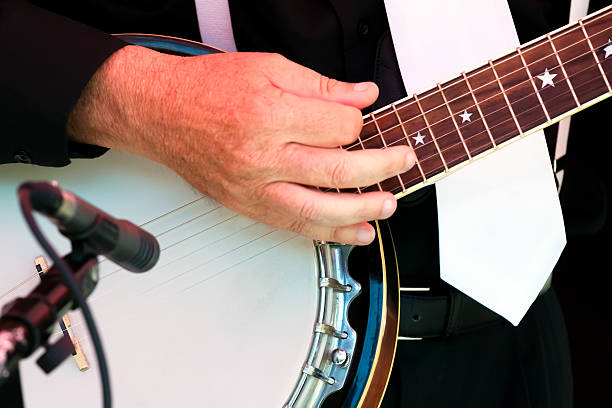 istock Closeup male musician hand with banjo 485556991