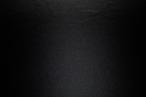 Close-up shot of black satin texture background.