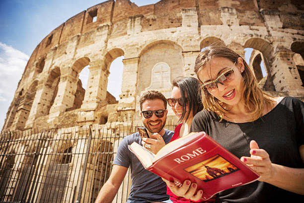 istock Tourists with a guide in front of the Coliseum, Rome 485557599