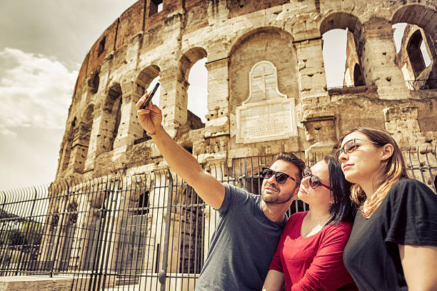 istock Tourists taking a selfie in front of the Coliseum, Rome 485557603