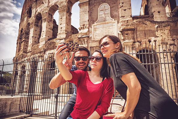istock Tourists taking a selfie in front of the Coliseum, Rome 485557607