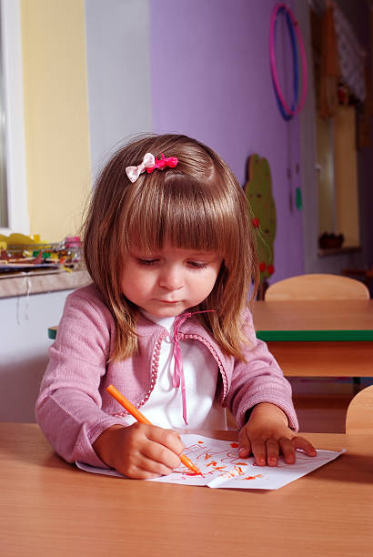 istock Two-year girl playing and learning in preschool 485558146
