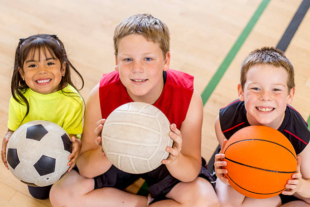 istock Children Sitting on Gym Floor 485558724