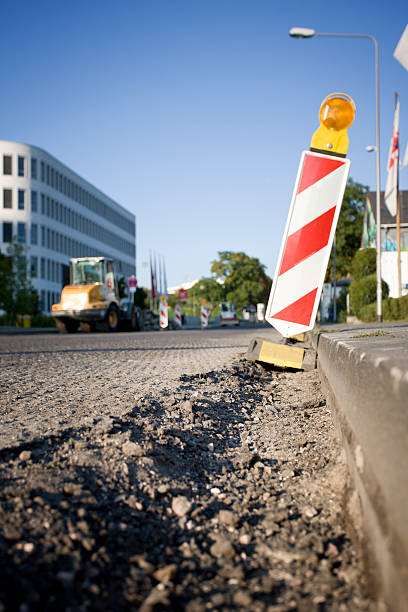 Road under construction Road under construction. Low-angle view, selective focus on foreground curb photos stock pictures, royalty-free photos & images