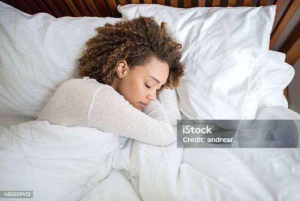 African American Woman Sleeping In Bed Stock Photo - Download Image Now - Sleeping, Women, One Woman Only