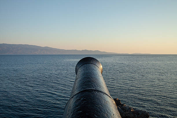 Ancient greek cannon facing the sea