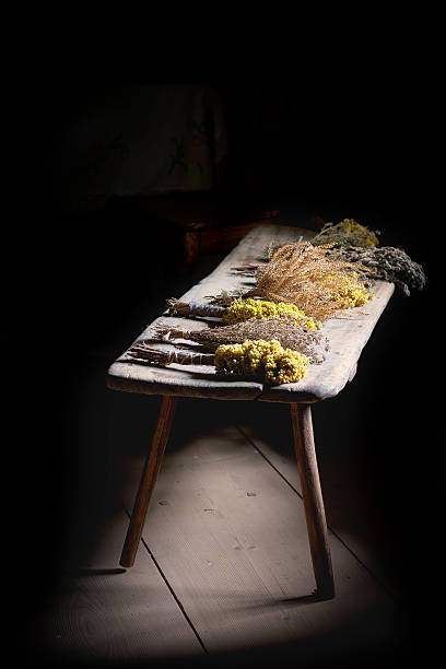 istock Bundles of dried herbs on a wooden bench 485560849