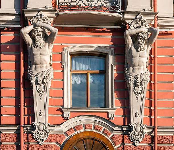 detail of the exterior of the Belosselsky-Belozersky Palace facade - two atlases squlptures holding the balcony, St Petersburg, Russia