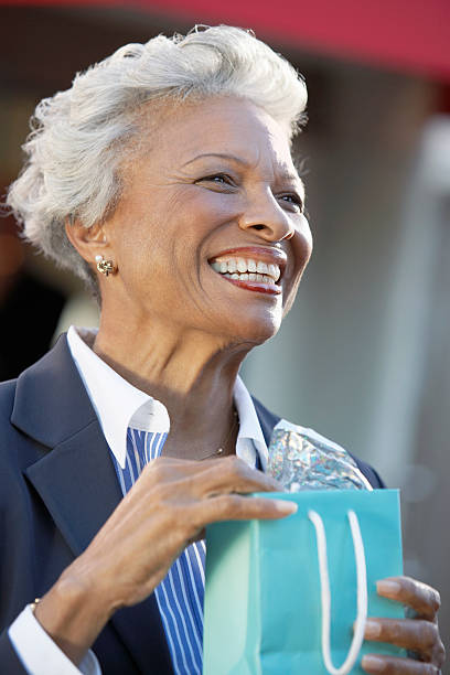 istock Smiling Woman with Shopping Bag 485563083
