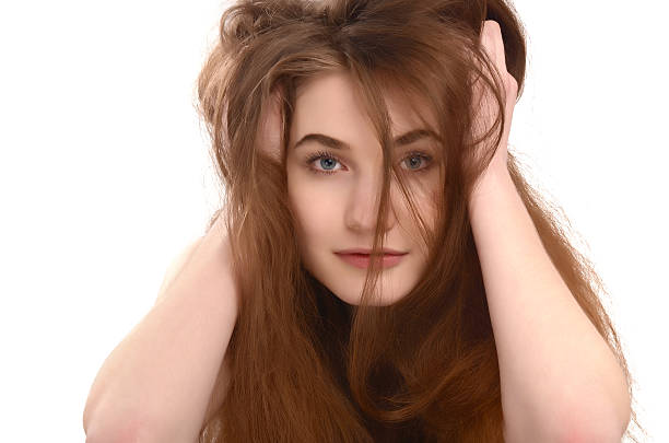 Young girl with messy long brown hair. stock photo