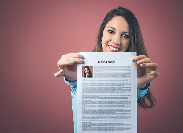 istock Young woman holding her resume 485570332
