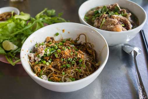 Pho is extremely popular in Vietnam. However, another noodle dish, this one called Hu Tieu Nam Vang, might be equally as popular, and widely available everywhere you look throughout Saigon.