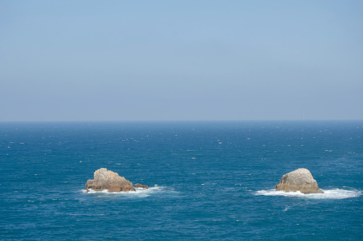 Isolated rocks in the sea. Santander, Spain.