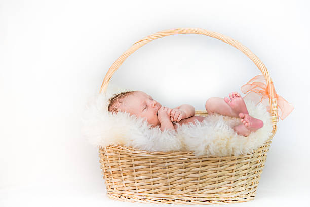 istock Happy newborn Baby in Basket 485573400