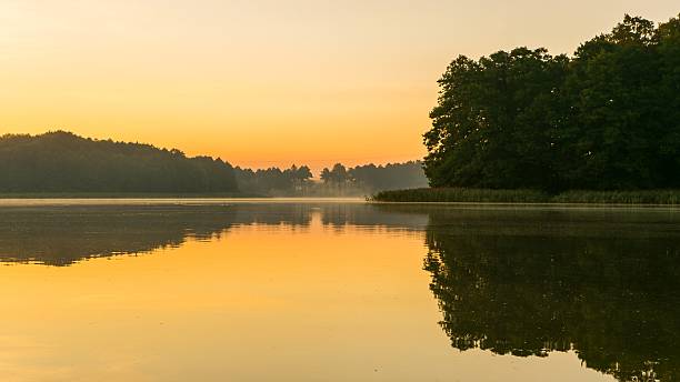 istock Beautiful sunrise over lake 485574282