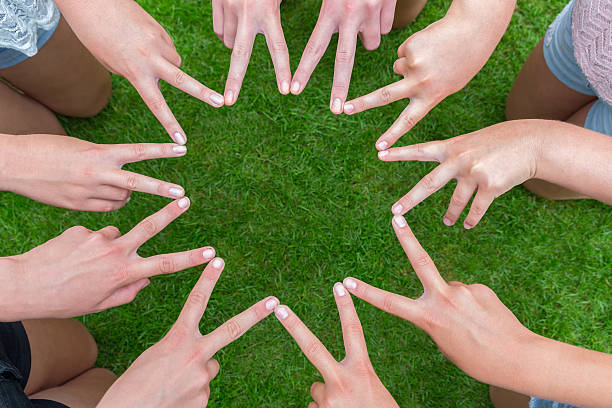 istock Many arms of children with hands making star 485579922
