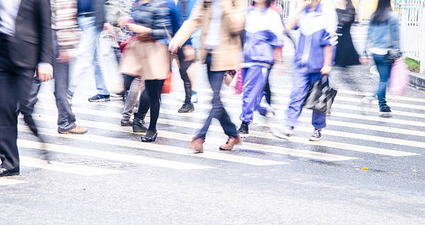 istock People walking on big city street 485582489