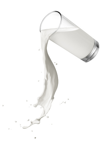 glass of spilling milk with twisted splash